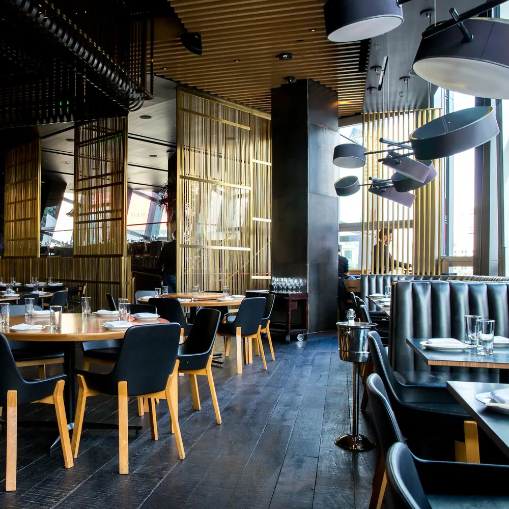 A bright dining room with wooden tables